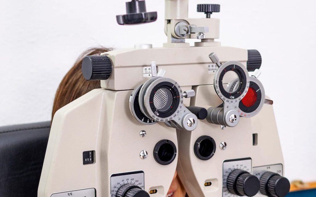 A phoropter set up in the examination room