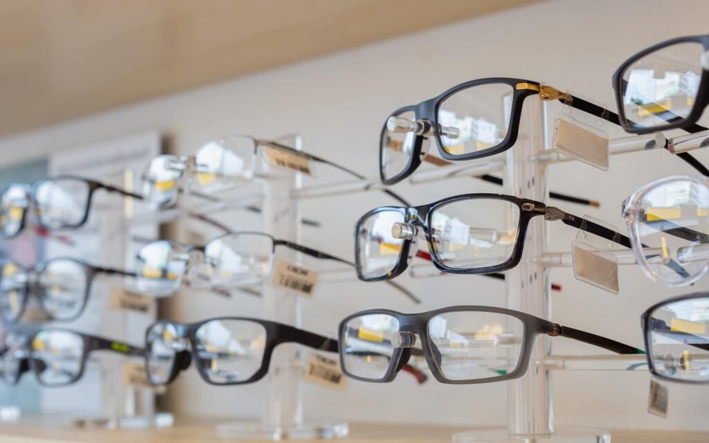 A row of spectacle frames on a shelf