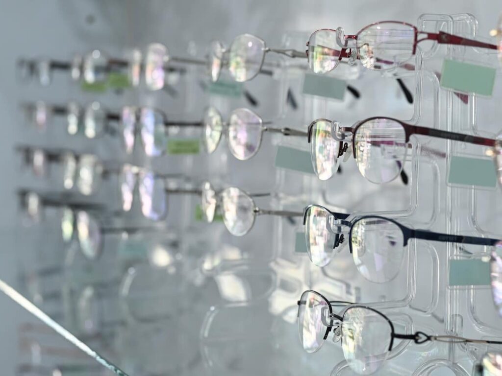 A single acetate spectacle frame on a plain surface