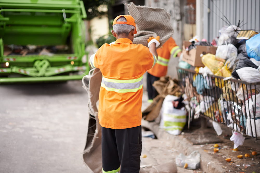 garbage-collectors-working-on-an-urban-street-2026-03-25-02-23-12-utc