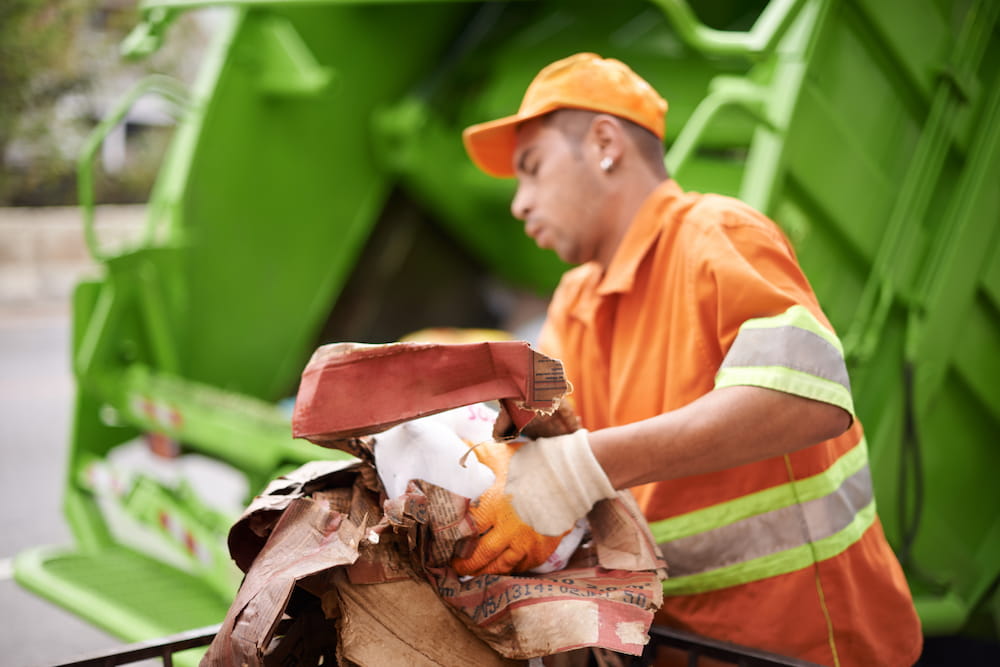 man-working-with-recycling-on-city-street-2026-03-25-07-07-51-utc