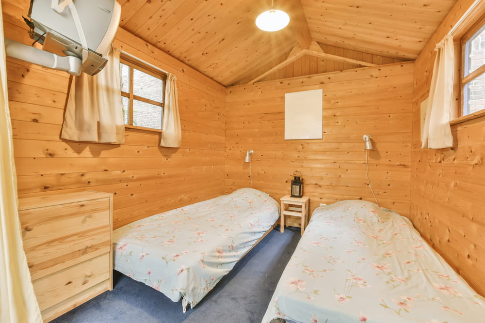 cozy-bedroom-with-rustic-wooden-walls-and-decor-2026-03-18-12-11-22-utc